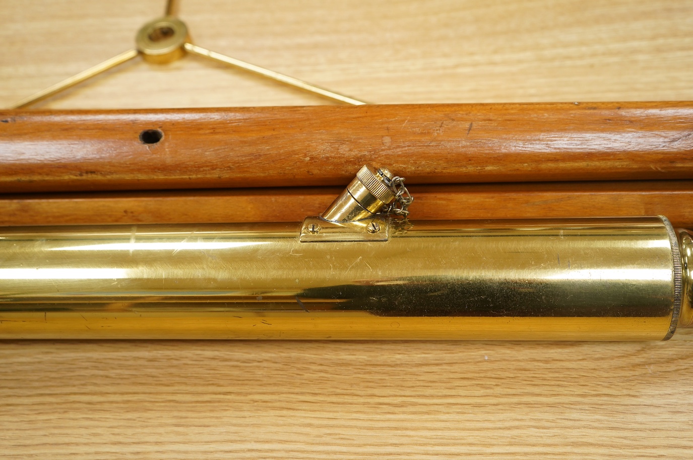 An early 20th century brass telescope with teak tripod by W. Ottway & Co., engraved with; Orion Works Ealing, ‘No.1058, VP 7 to 21 Day & Night Sight Patent 1906’, telescope 65cm long, tripod 160cm. Condition - good.